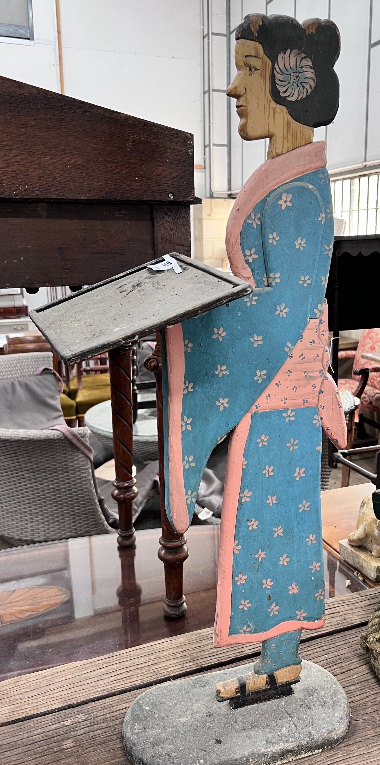 A painted wood figural dumb waiter, height 93cm *Please note the sale commences at 9am.